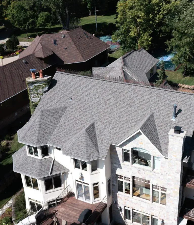 Completed architectural shingle roof replacement on a large Minnesota home