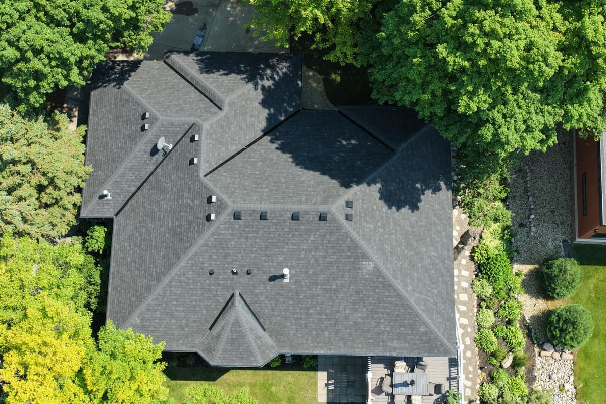 Top-down drone view of a new charcoal shingle roof in Alexandria, MN