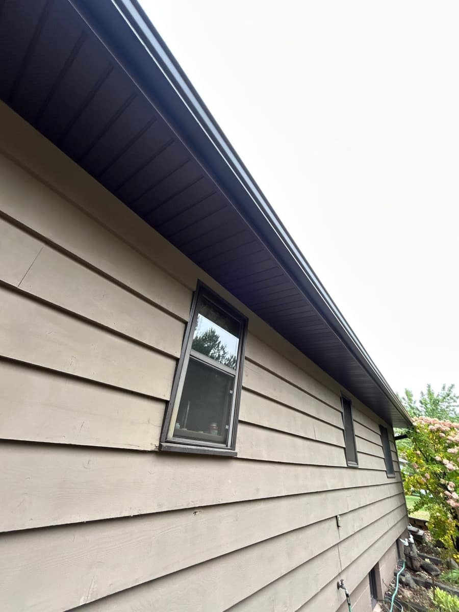 New brown soffit, fascia and gutter along the eave of a Baxter, MN home