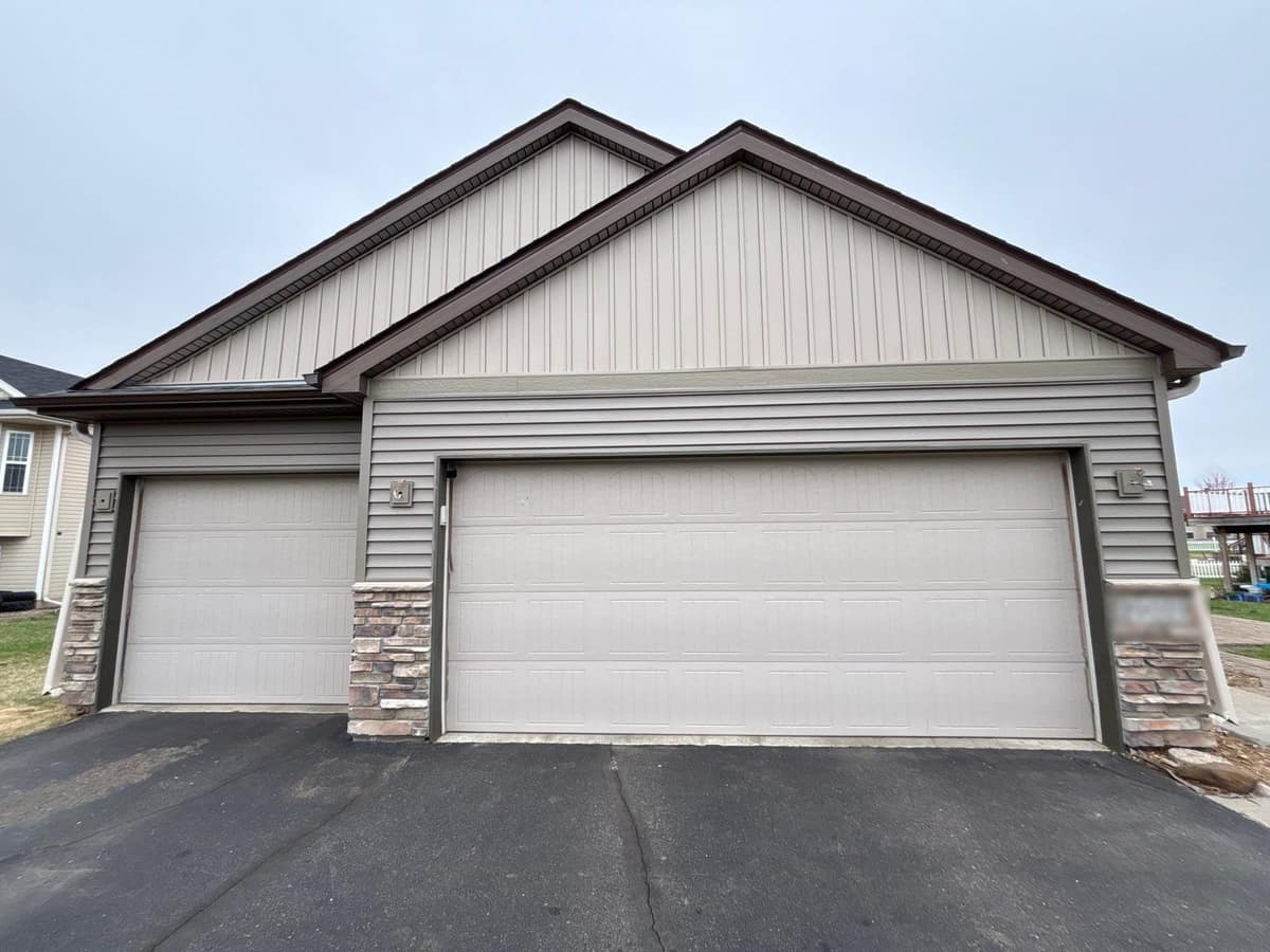New vinyl siding and vertical gable siding on a garage-front home in Big Lake, MN