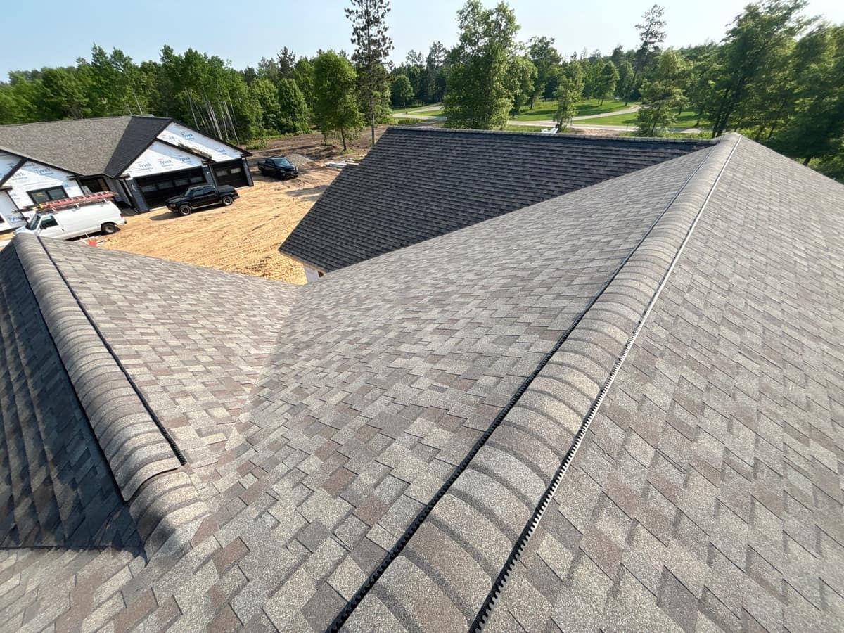 New architectural shingle roof with ridge vent on a new-build home in Brainerd, MN