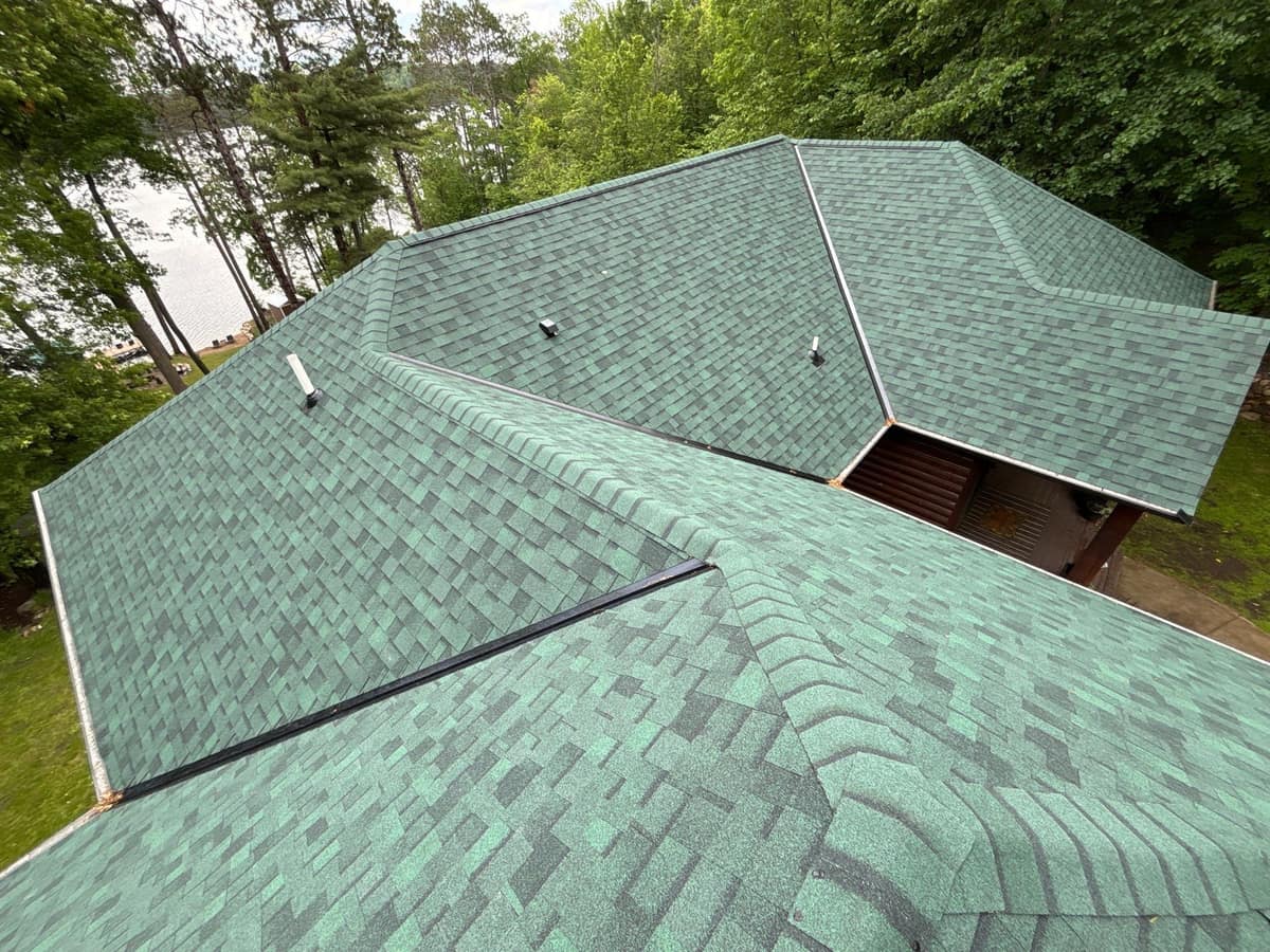 New green shingle roof with ridge vents on a home near the water in Crosslake, MN