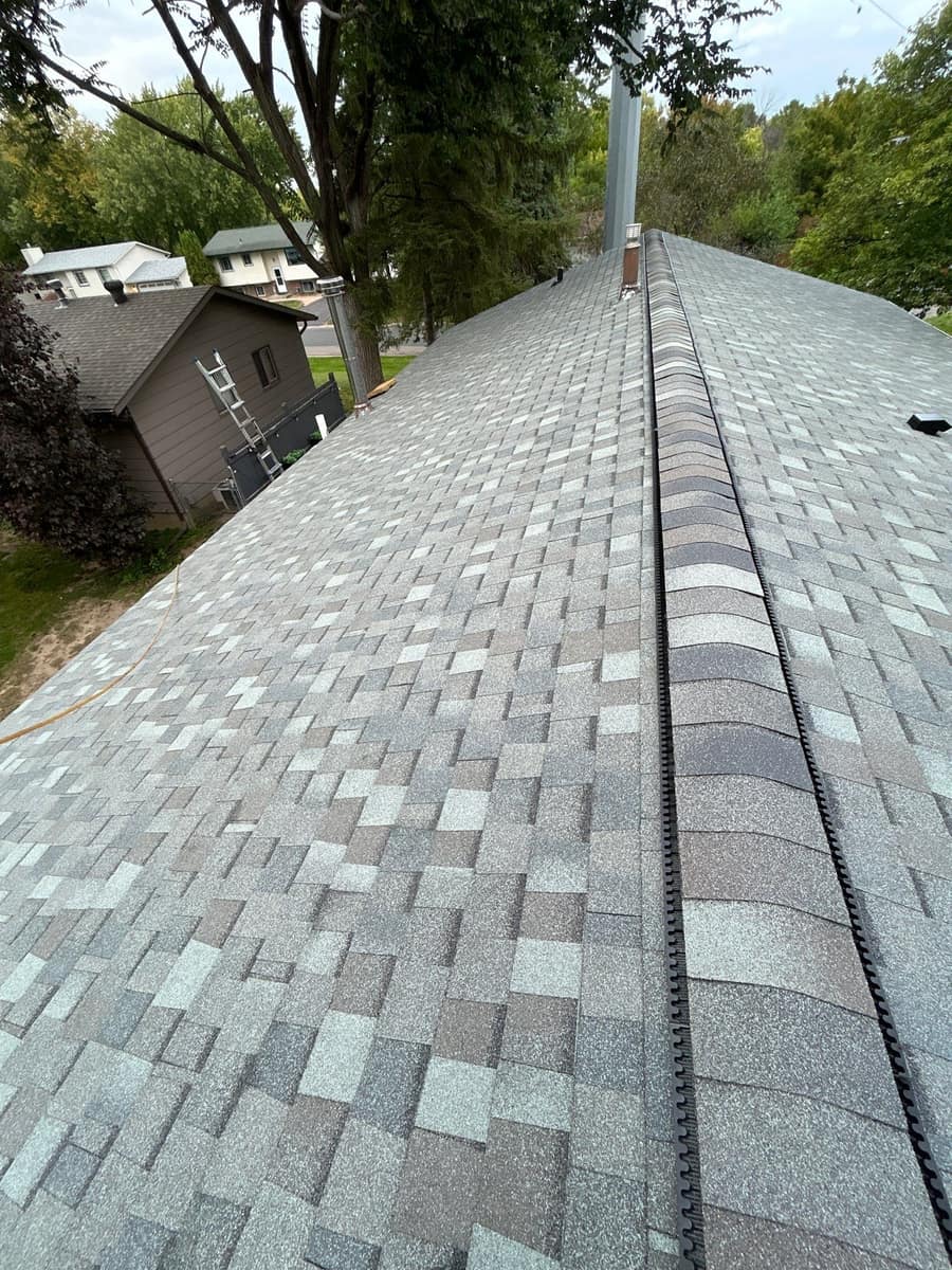 Finished architectural shingle roof with ridge vent in Maple Grove, MN