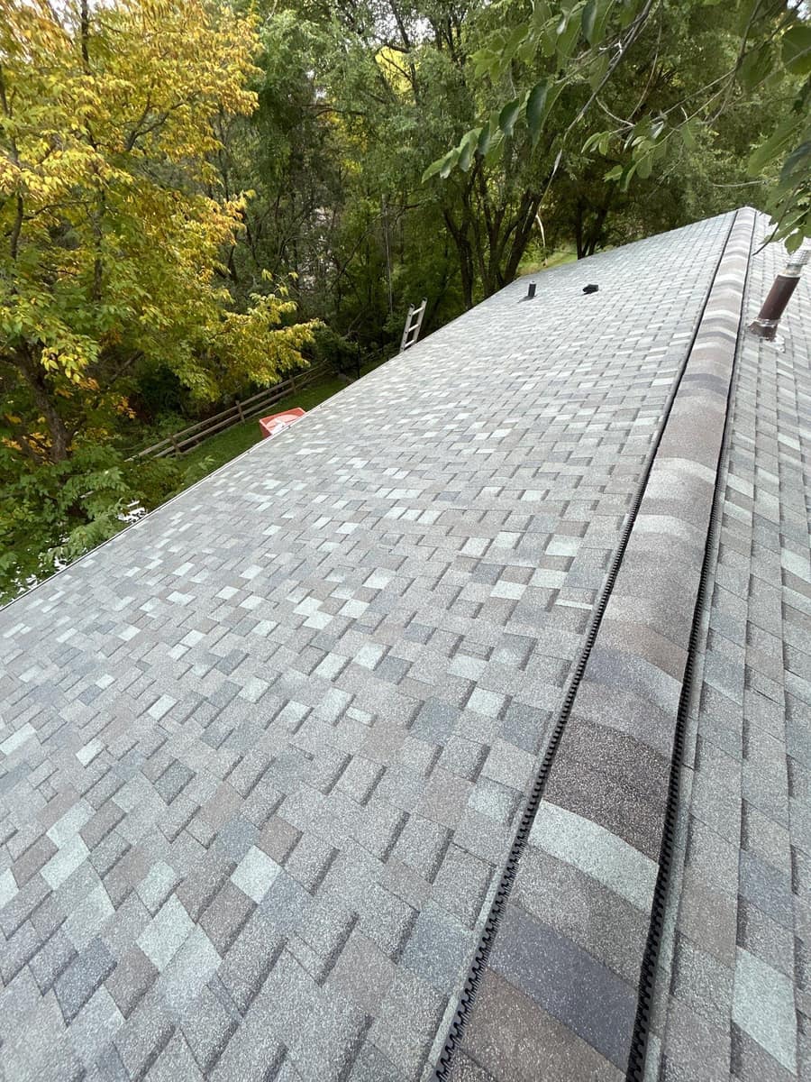 New ridge cap and ridge vent on a just-finished shingle roof in Maple Grove, MN