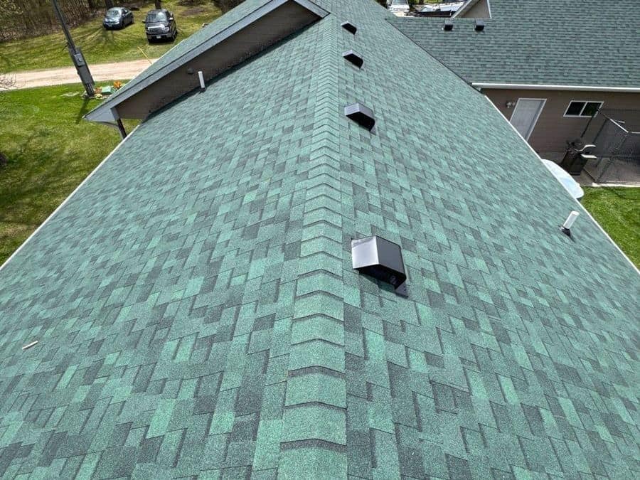 New green asphalt shingle roof with black roof vents in Milaca, MN