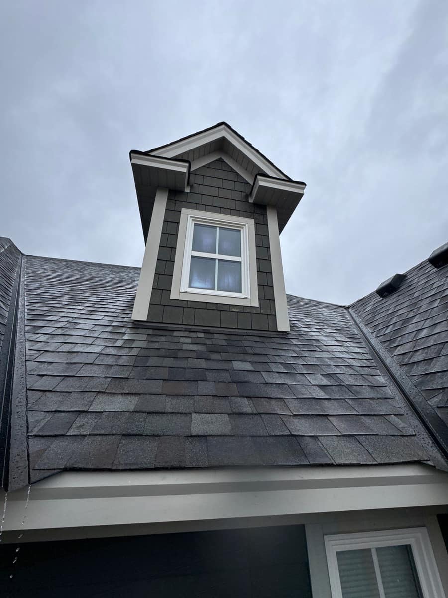 New shingles around a dormer on a finished roof in Plymouth, MN