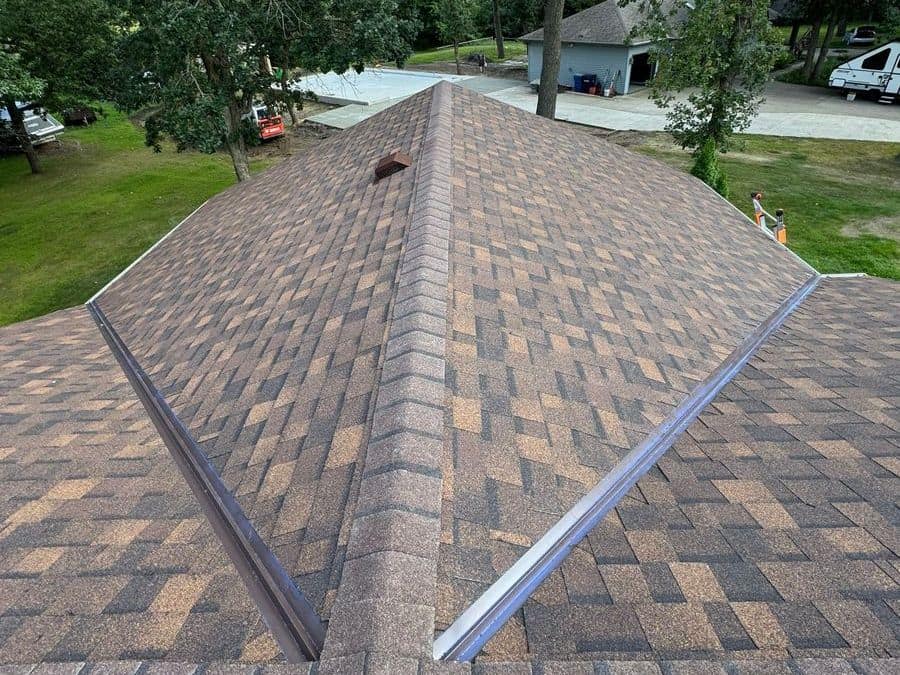 New brown asphalt shingle roof with metal valleys on a home in Rice, MN
