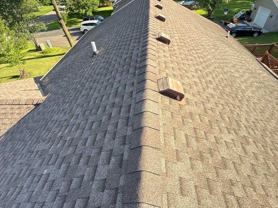 New tan-brown shingle roof with roof vents above a Rice, MN neighborhood