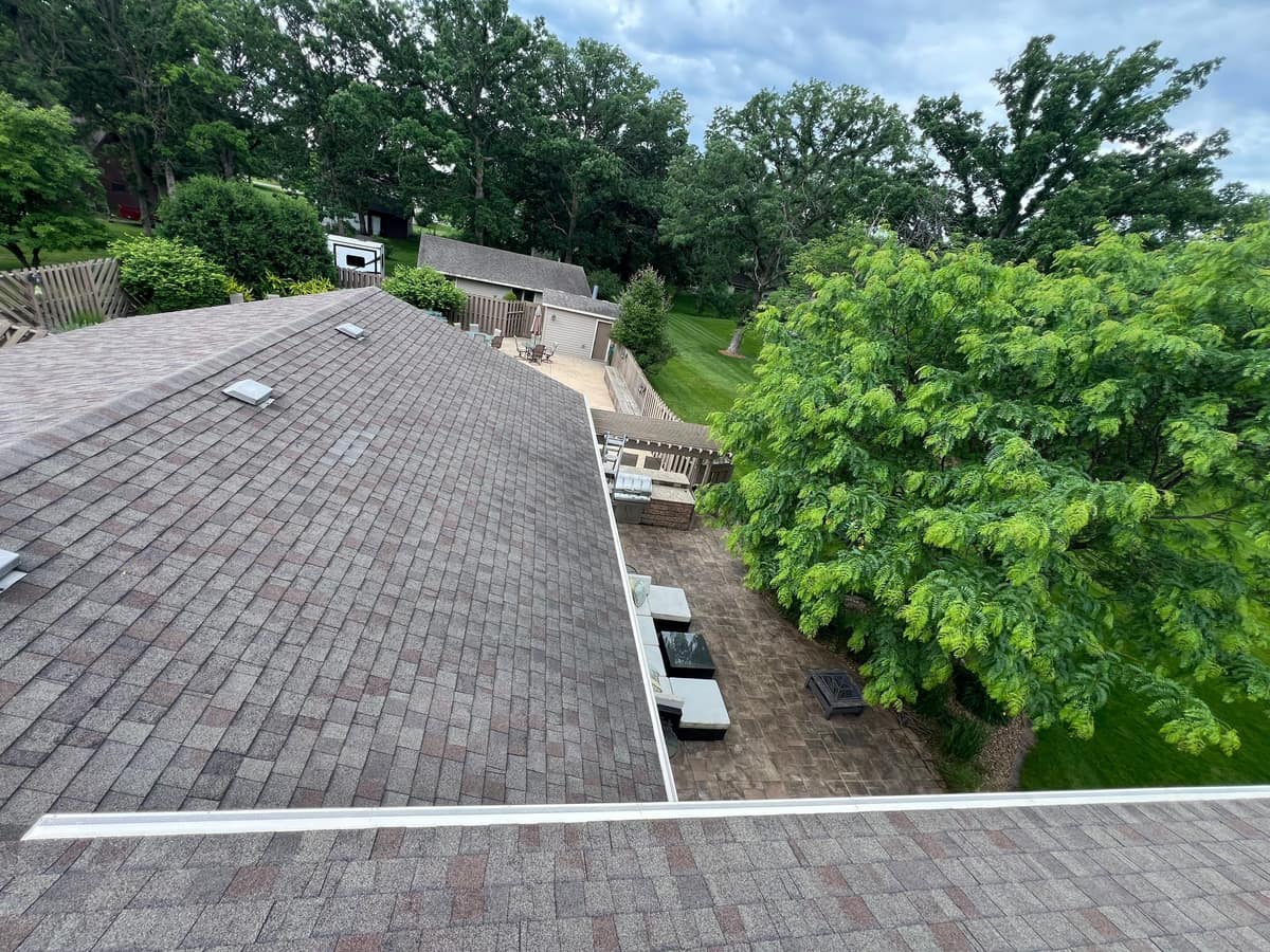 New architectural shingle roof over a backyard patio in Sartell, MN