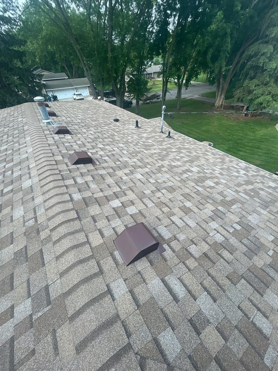 New tan architectural shingle roof with box vents in Sauk Rapids, MN