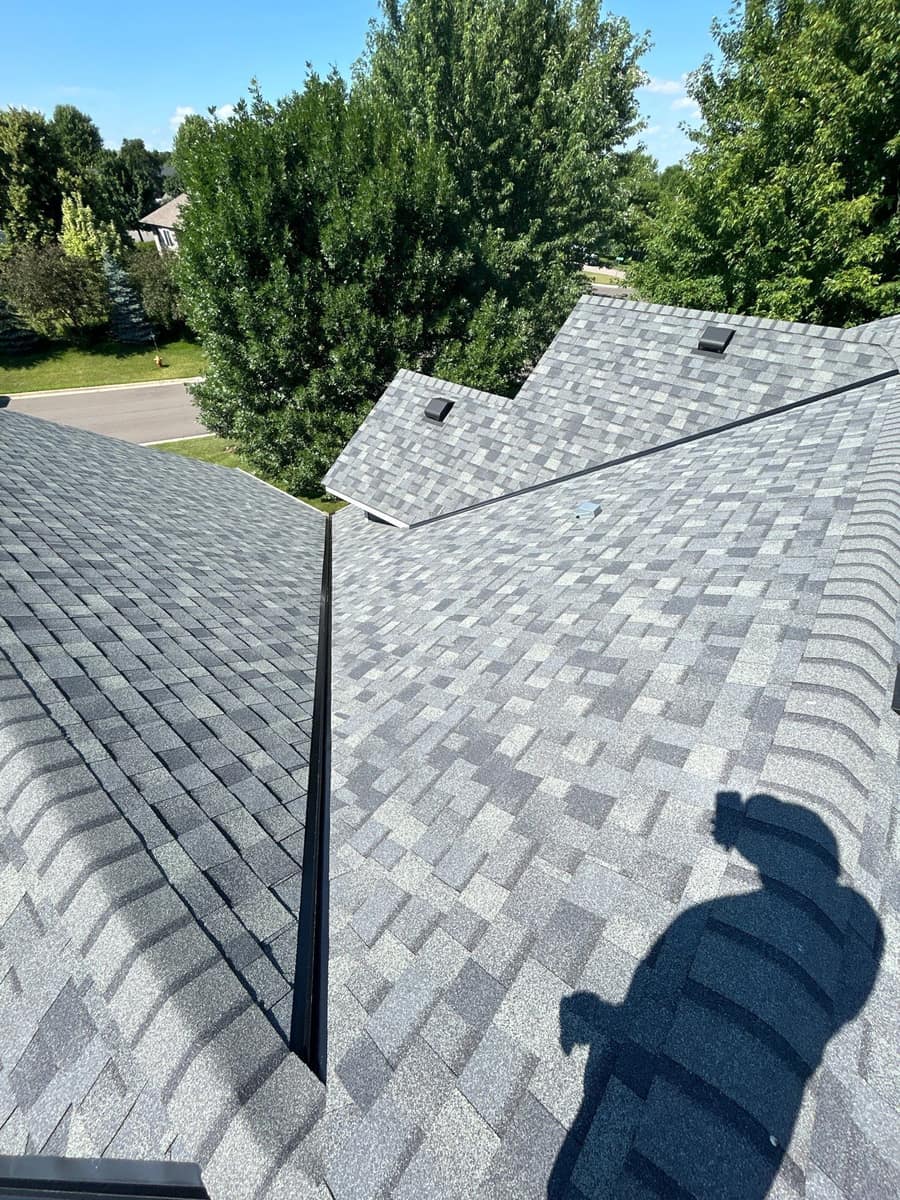 New gray shingle roof valleys on a Sauk Rapids, MN home