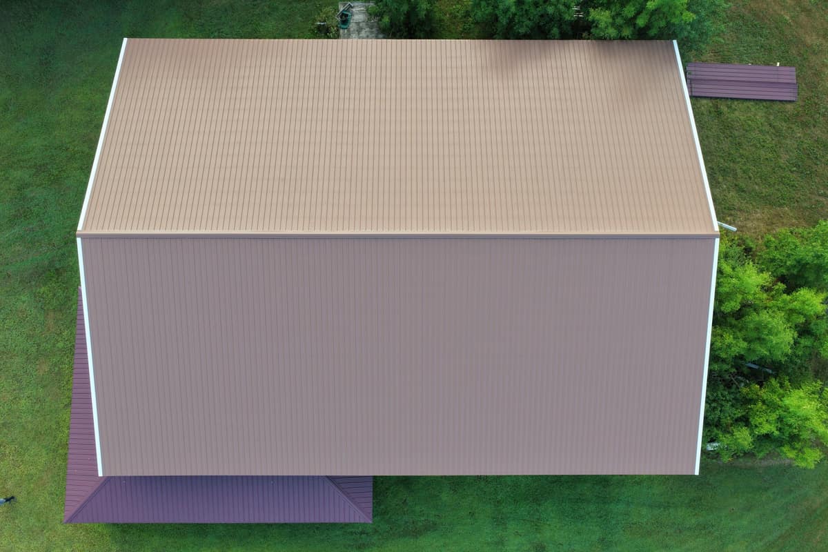 Top-down drone view of a brown metal roof on a large outbuilding in St. Augusta, MN