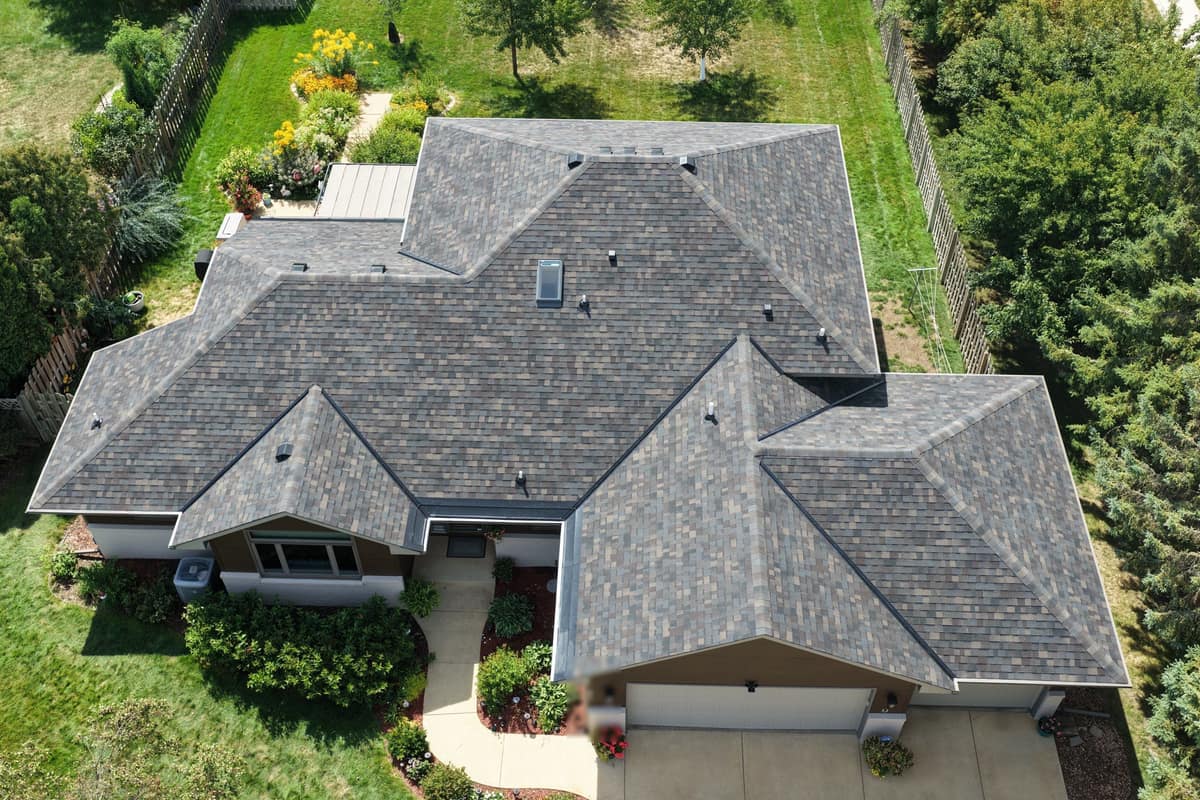 Drone view of a finished dark shingle roof on a ranch home in St. Cloud, MN