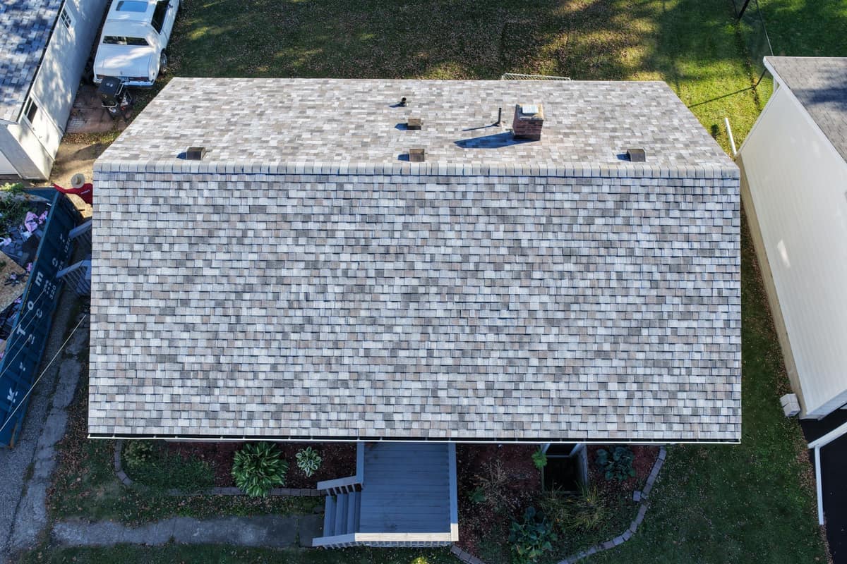 Top-down drone view of a new gray shingle roof in Waite Park, MN
