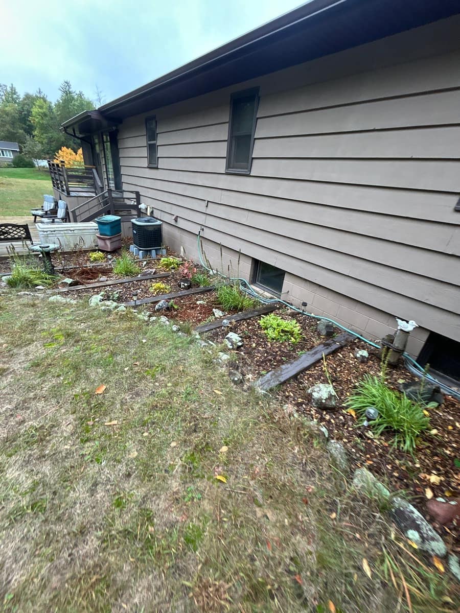 New brown gutter and fascia running the length of the Baxter home