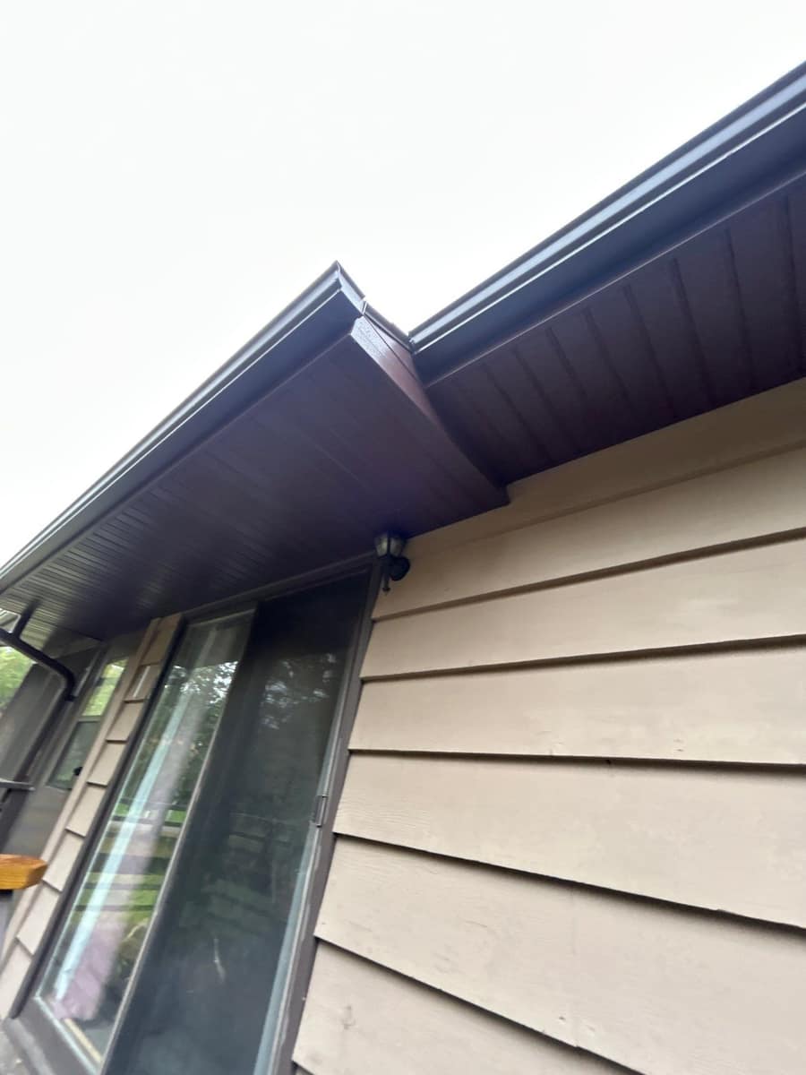 Close view of new dark brown soffit and fascia on the Baxter home