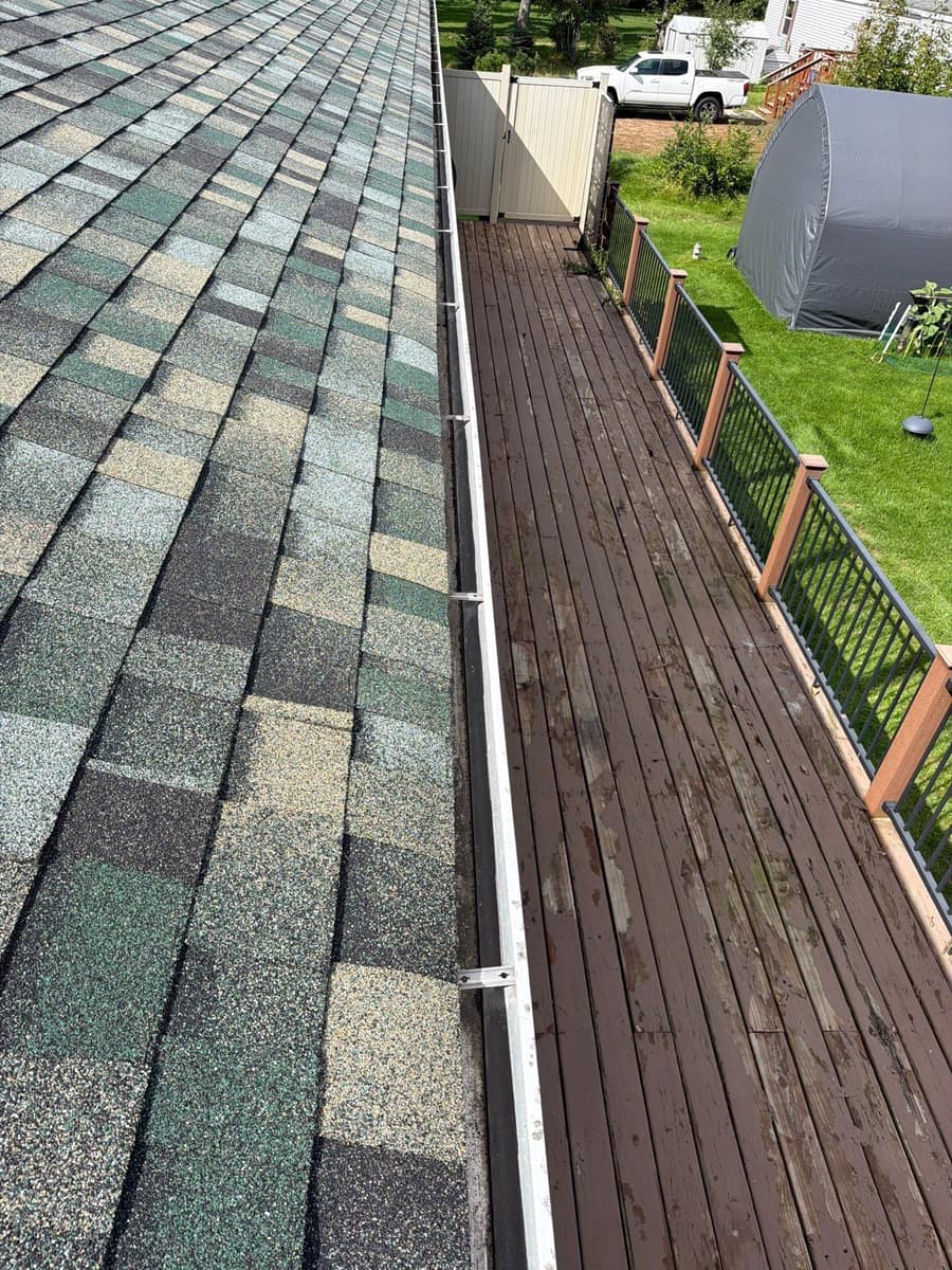 New shingle edge and white gutter above the back deck of the Brainerd home