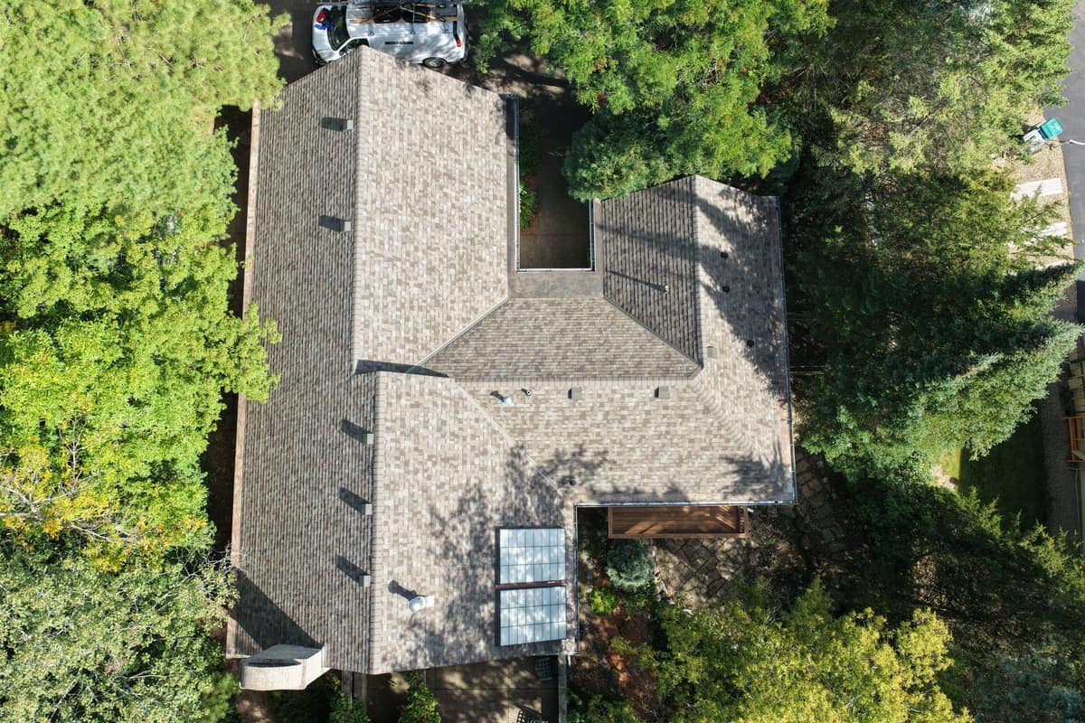 Top-down drone view of the new Minnetonka roof with a row of roof vents and skylights