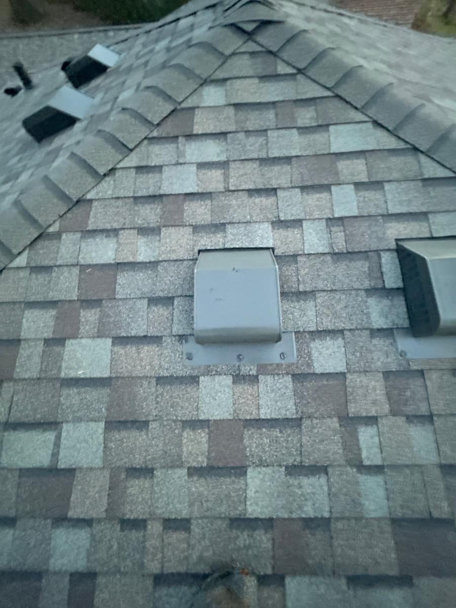 Close view of new shingles and roof vents near the ridge in Minnetonka