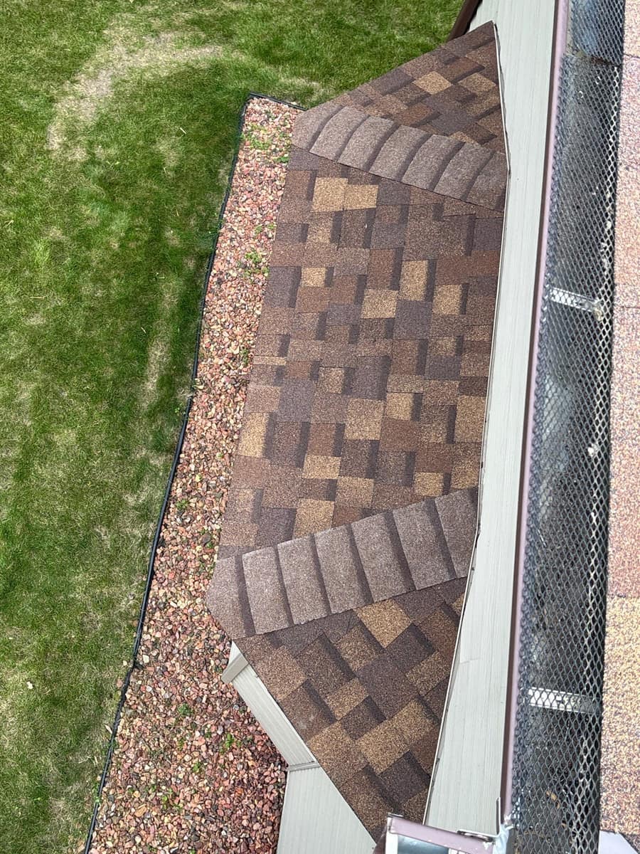 New shingle edge above a gutter with a guard on the Monticello home