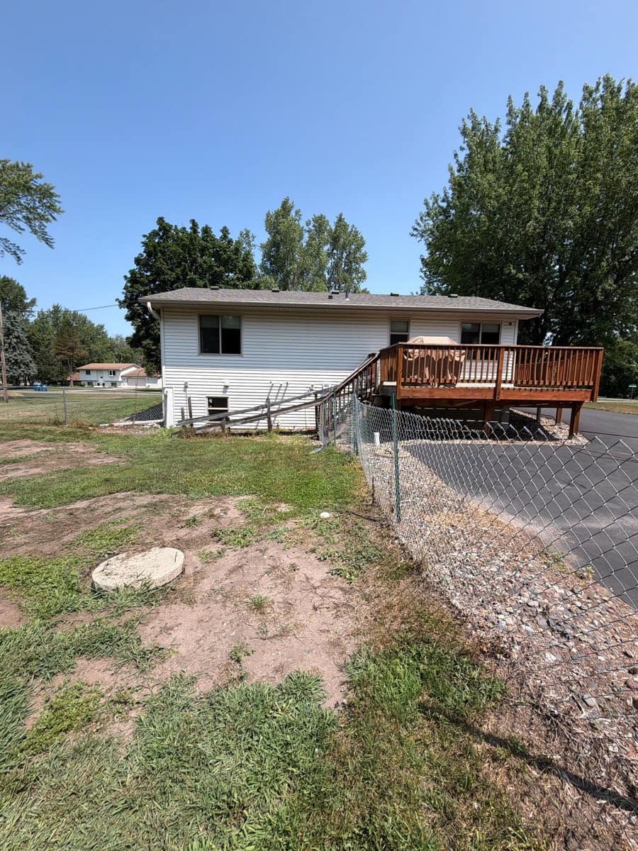 Rear yard view of the Otsego home after the roof replacement