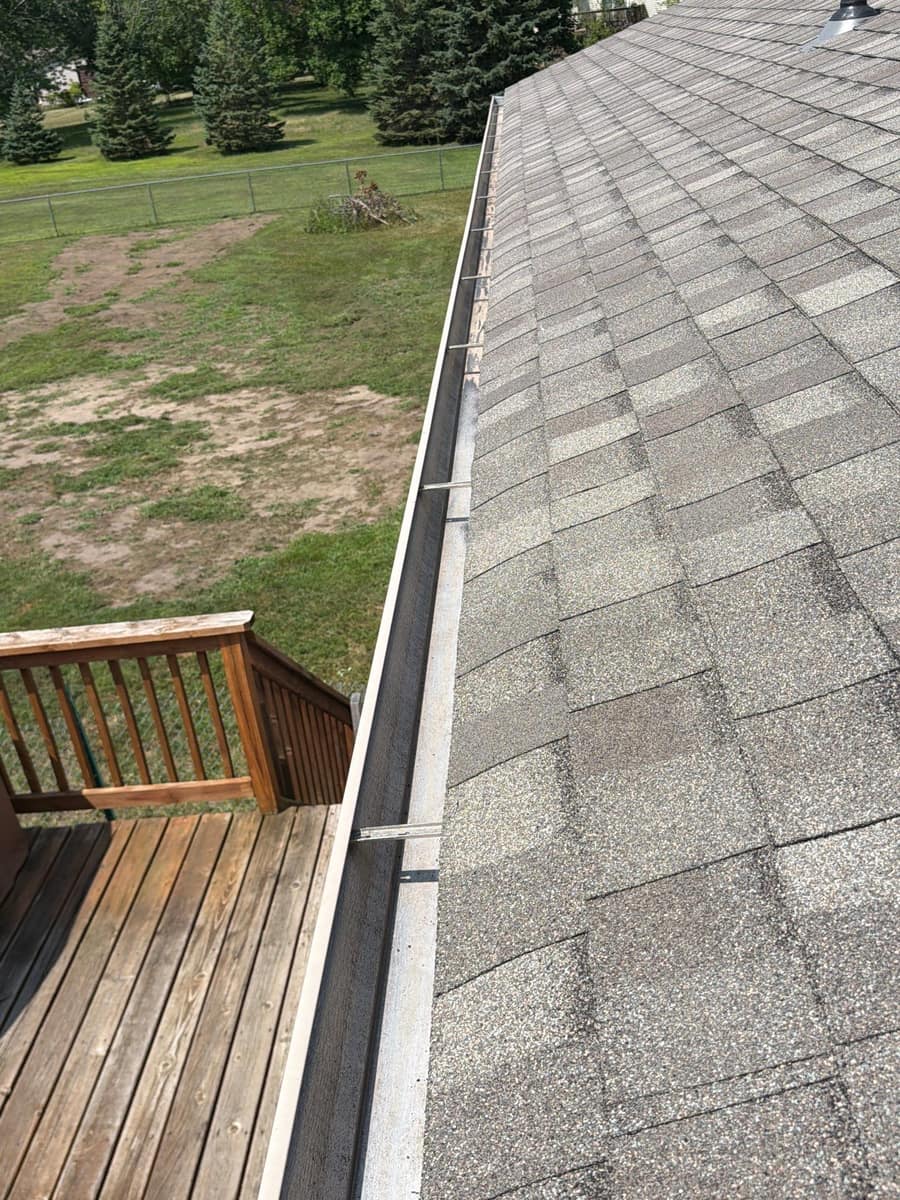 New shingle edge and gutter above the deck in Otsego