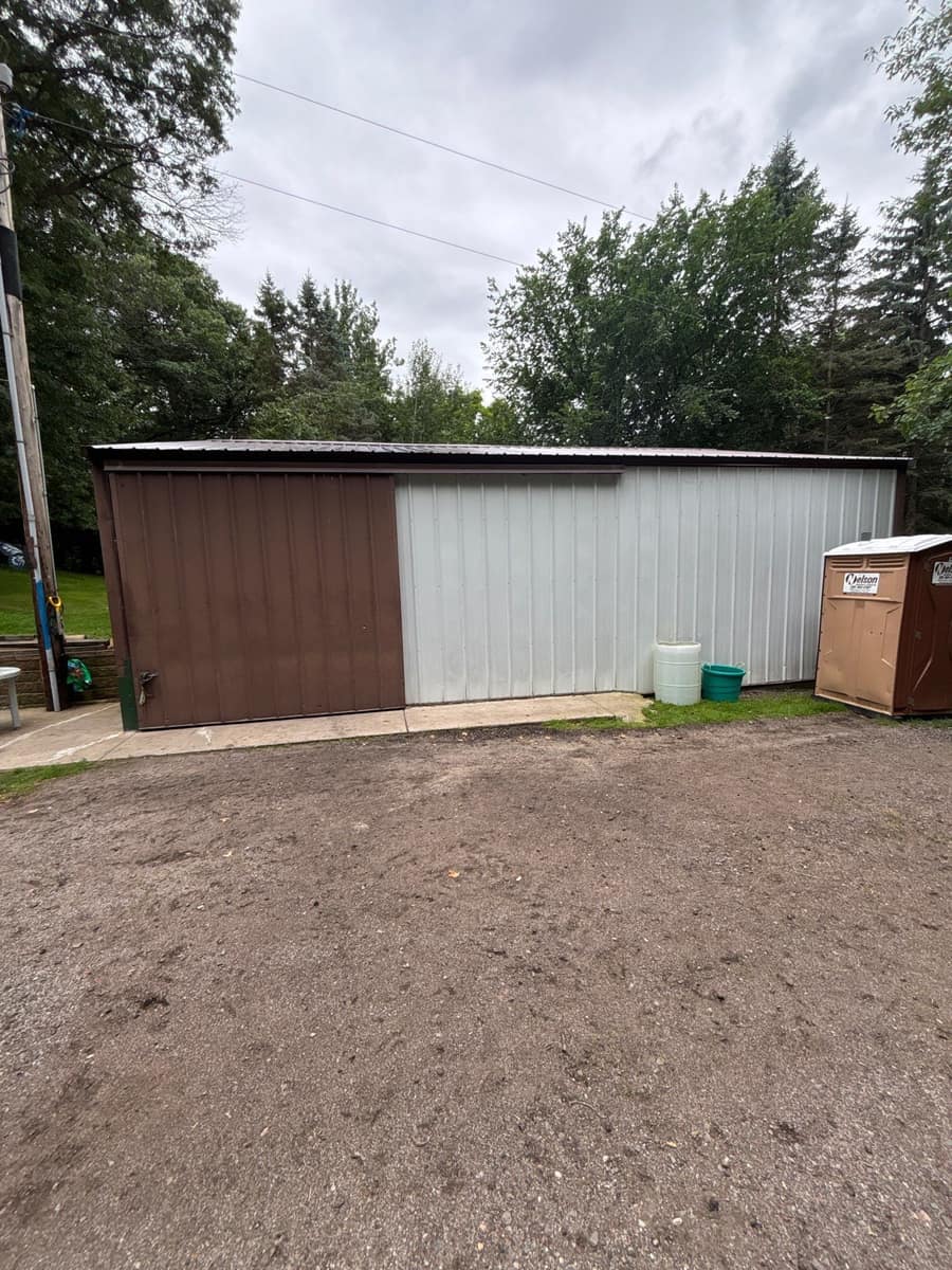 Pole-style outbuilding in Sartell, MN with a new brown steel roof