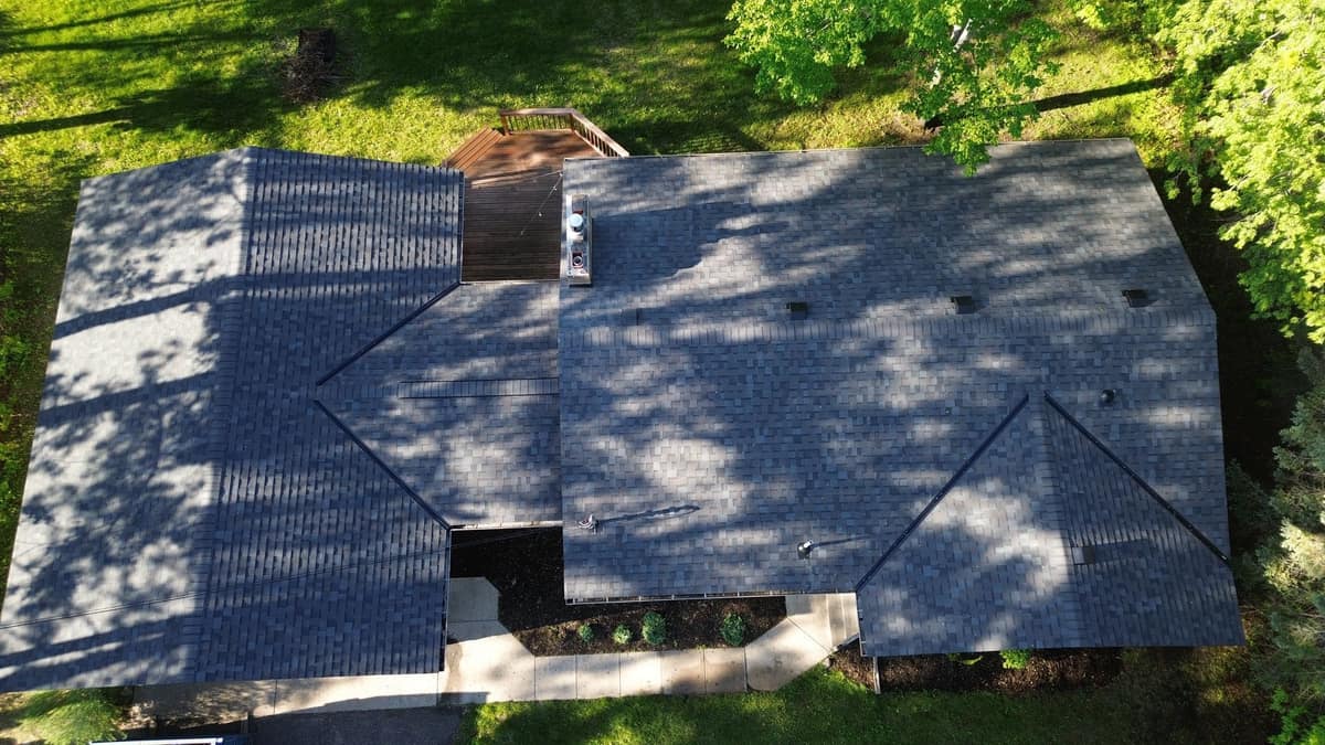 Overhead drone view of the new charcoal shingle roof on the Sartell home