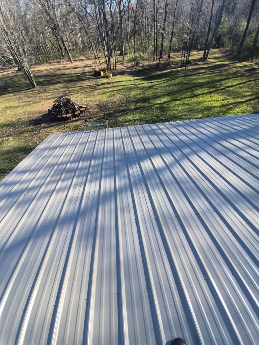New light steel roof panels on the detached garage, seen from the roof edge in St. Augusta