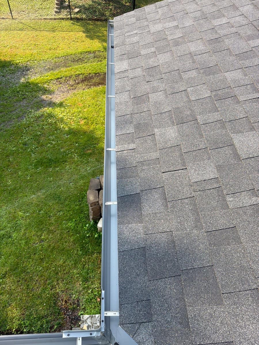 New shingle edge and gutter at a roof corner in St. Cloud
