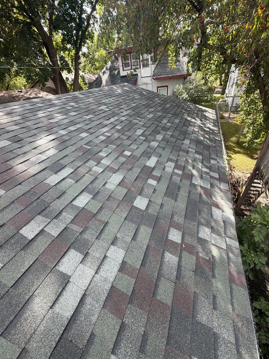 Wide view of the new shingle roof plane on the St. Cloud home