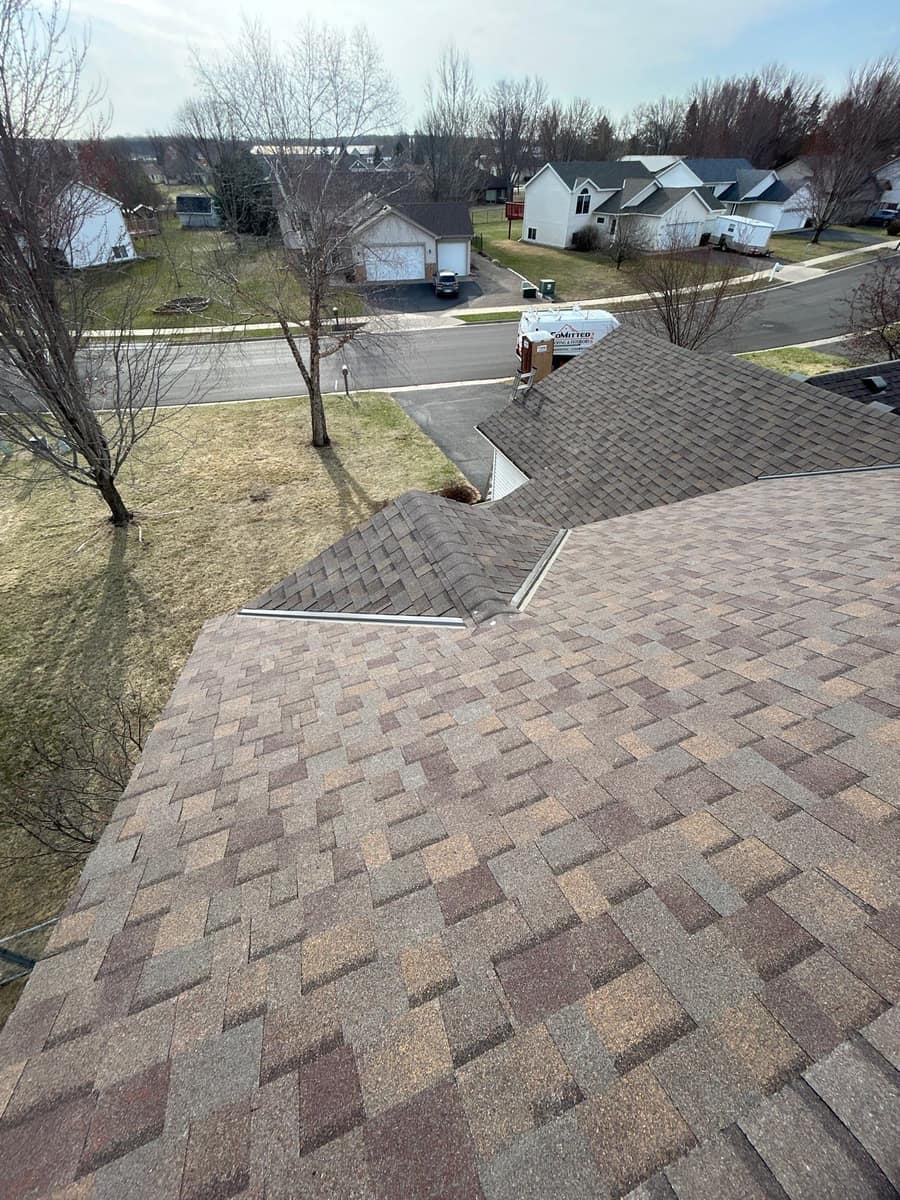 New shingles across intersecting roof sections in Waite Park