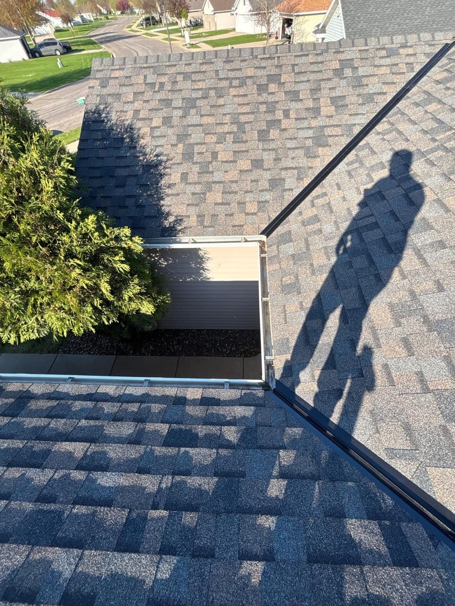 New shingles and metal valley flashing on the Waite Park roof