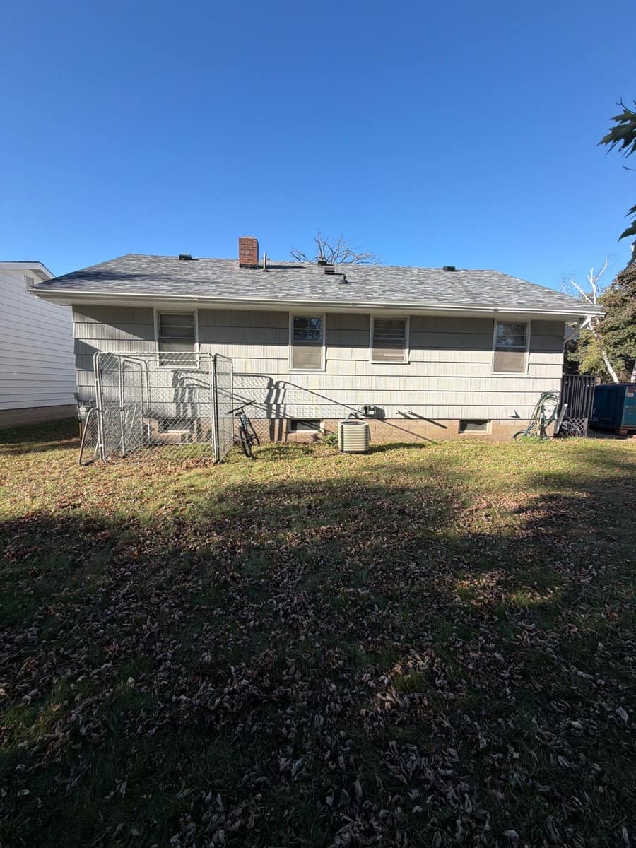 Rear yard view of the Waite Park home with the new roof