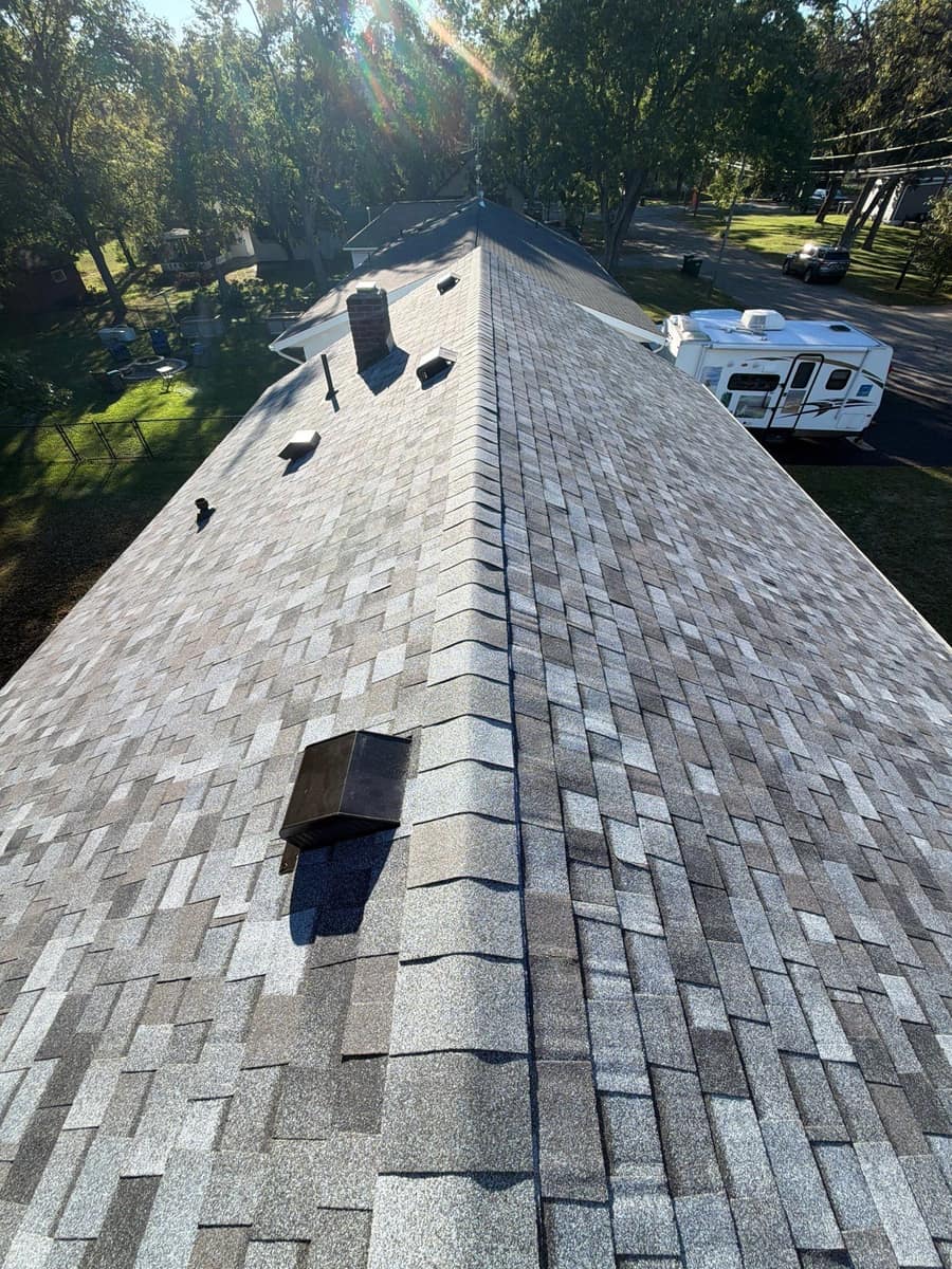 New gray blend shingles and roof vents along the ridge in Waite Park