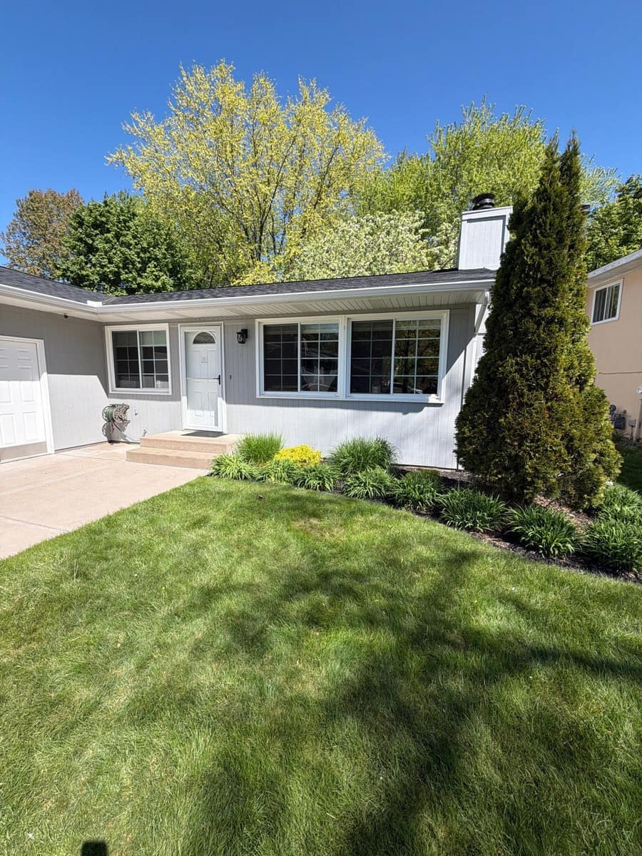 Light gray single-story Woodbury home with a new shingle roof